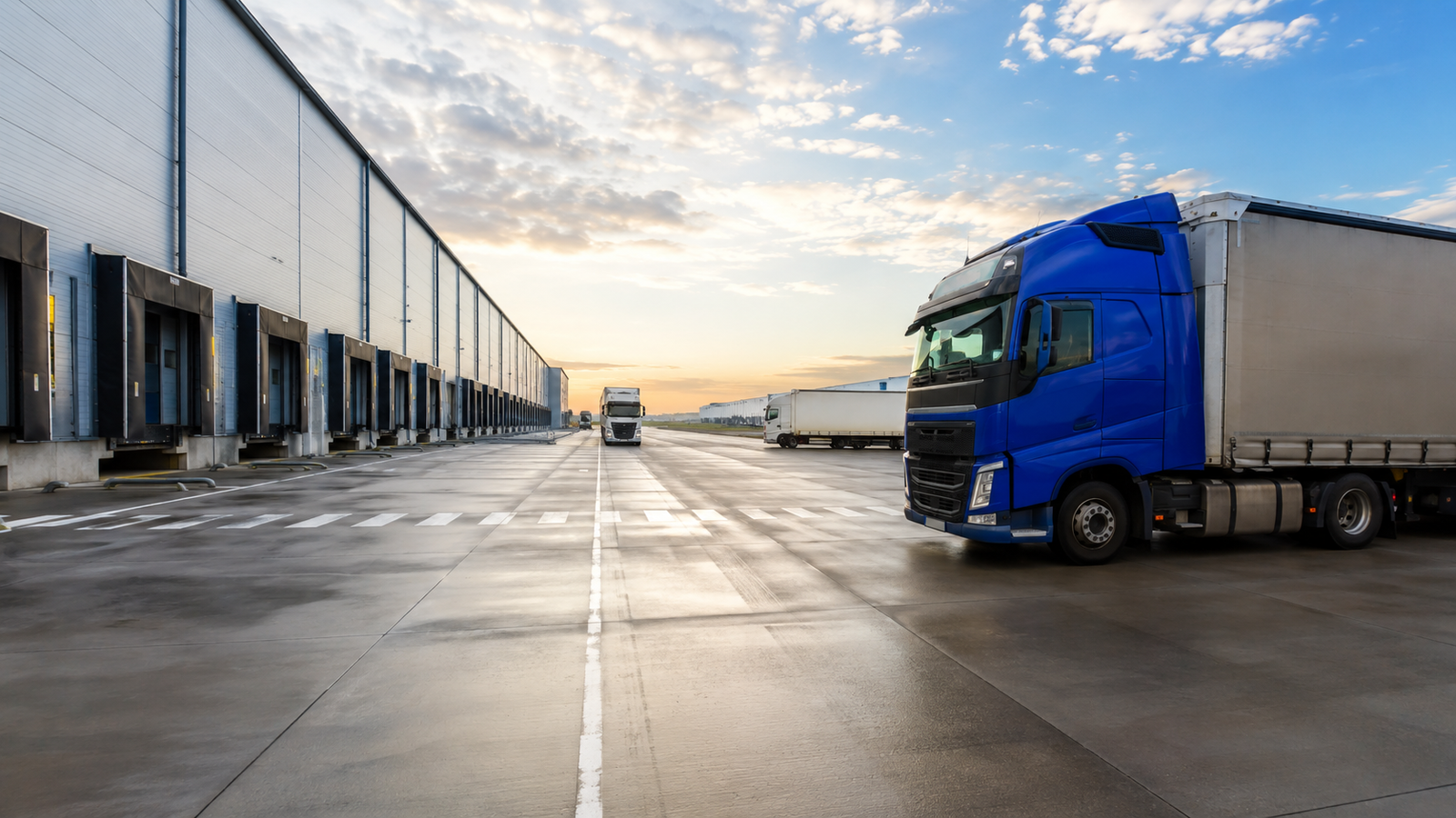 Industrial floor care equipment operating in a logistics and transport facility